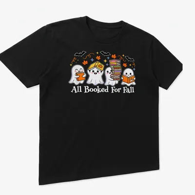 Kawaii cartoon style shirt with ghosts reading books and colorful text — printed on a unisex t-shirt (angled view)