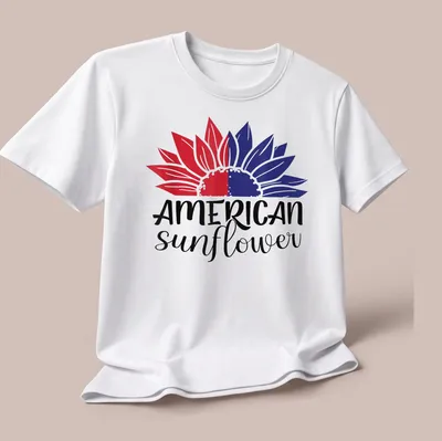 Bold illustration of an American sunflower in red, white, and blue colors — printed on a unisex t-shirt (angled view)