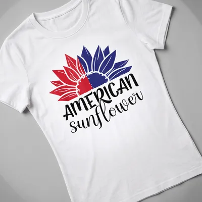Bold illustration of an American sunflower in red, white, and blue colors — printed on a women's shirt