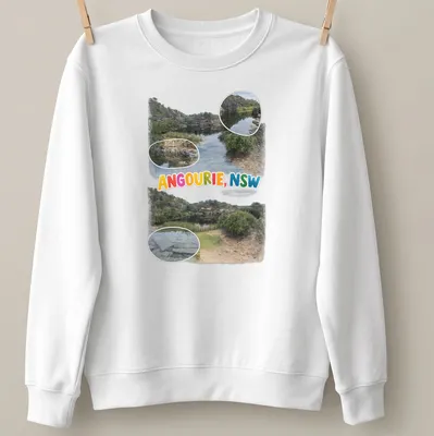 Colorful illustration of a scenic landscape depicting water and rocks with text "ANGOURIE, NSW" — printed on a unisex sweatshirt