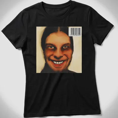 Digital art of a smiling face in brown, black, and white shades — printed on a women's shirt