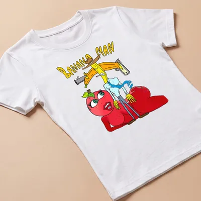 Colorful cartoon of Banana Man holding a gun with the text 'BANANA MAN' — printed on a women's shirt