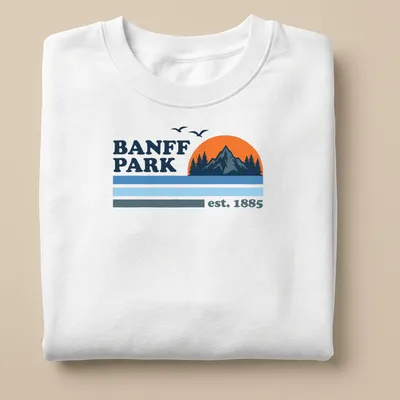 Vintage style t-shirt featuring a mountain sunset with trees in orange and blue — printed on a unisex sweatshirt