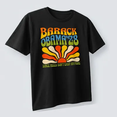 Psychedelic sunburst design featuring Barack Obama and humorous text — printed on a unisex t-shirt (angled view)