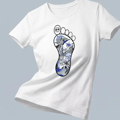 Illustrative beach footprint with ocean elements in blue, black, and gray — printed on a women's shirt