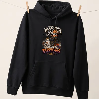 Vintage Halloween shirt featuring a crowned ghost, haunted house, and pumpkins. — printed on a unisex hoodie