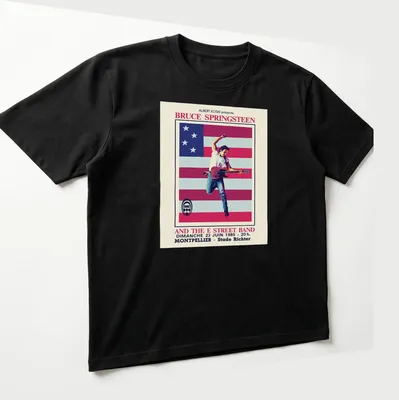 Vintage concert T-shirt featuring Bruce Springsteen and E Street Band details in red, white, blue, and black. — printed on a unisex t-shirt (angled view)