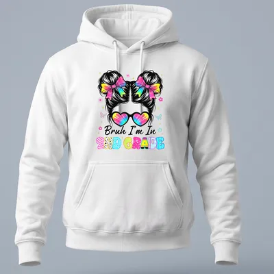Colorful cartoon t-shirt featuring a girl with a messy bun and the phrase Bruh I'm In 2Nd Grade. — printed on a unisex hoodie