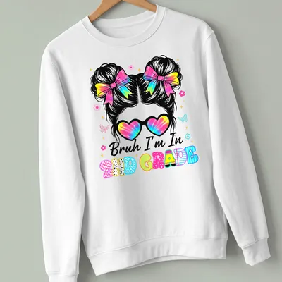 Colorful cartoon t-shirt featuring a girl with a messy bun and the phrase Bruh I'm In 2Nd Grade. — printed on a unisex sweatshirt
