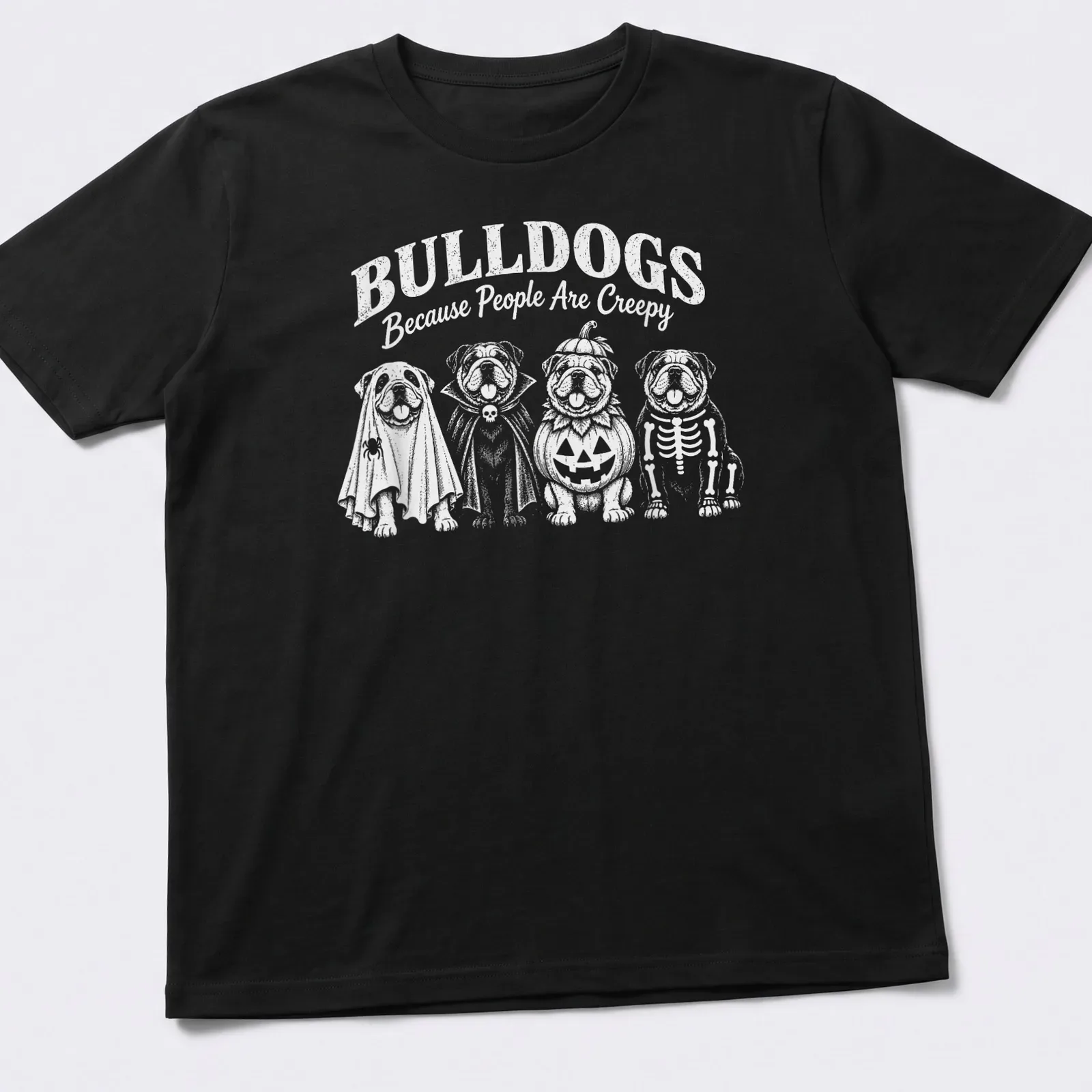 Playful cartoon bulldogs in Halloween costumes with humorous text — printed on a unisex t-shirt