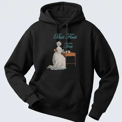 Vintage illustration of an Edwardian woman serving tea with the text 'But First Tea' — printed on a unisex hoodie