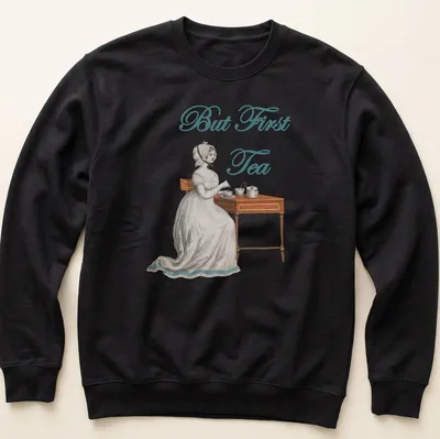 Vintage illustration of an Edwardian woman serving tea with the text 'But First Tea' — printed on a unisex sweatshirt