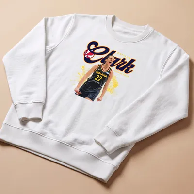 Bold graphic featuring Caitlin Clark playing basketball in red, yellow, black, and white — printed on a unisex sweatshirt