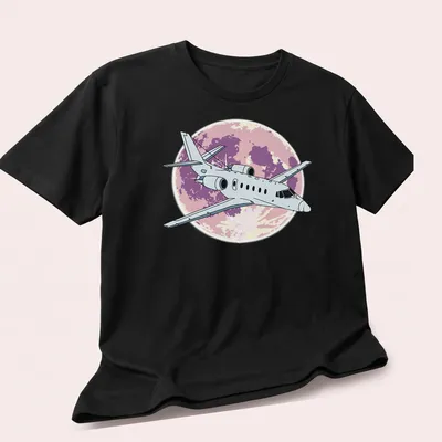 Illustrative design of a Cessna Citation jet flying at night with purple and pink hues — printed on a unisex t-shirt (angled view)