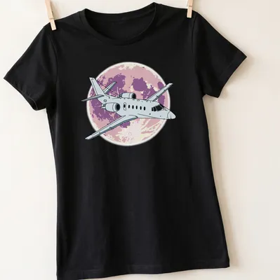 Illustrative design of a Cessna Citation jet flying at night with purple and pink hues — printed on a women's shirt