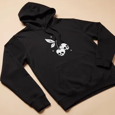 Line-art design featuring cherry skulls in black and white — printed on a unisex hoodie