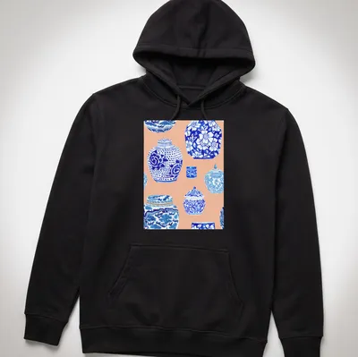 Watercolor print featuring a collection of ginger jars in blue, white, and peach — printed on a unisex hoodie