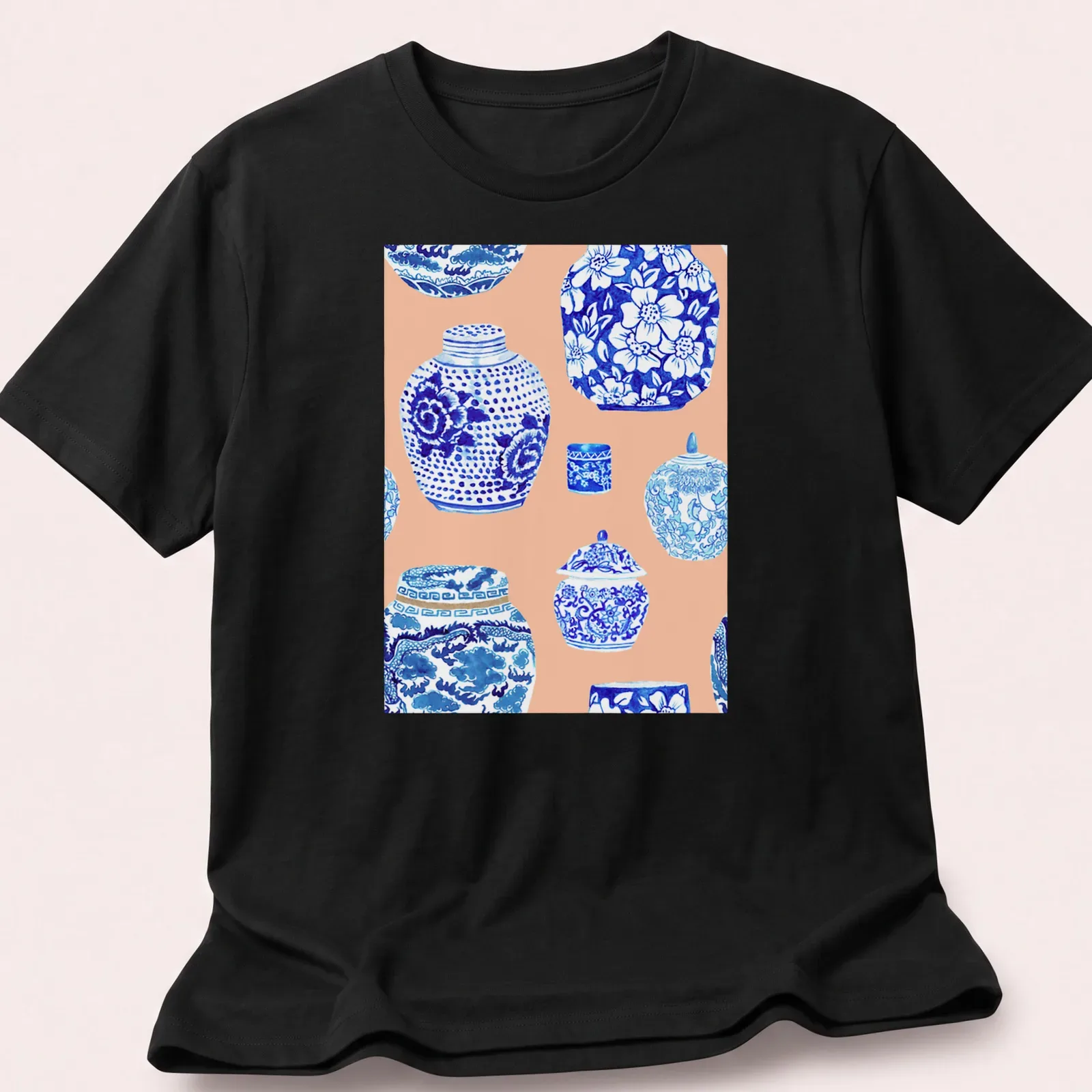Watercolor print featuring a collection of ginger jars in blue, white, and peach — printed on a unisex t-shirt