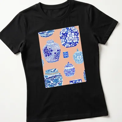 Watercolor print featuring a collection of ginger jars in blue, white, and peach — printed on a women's shirt