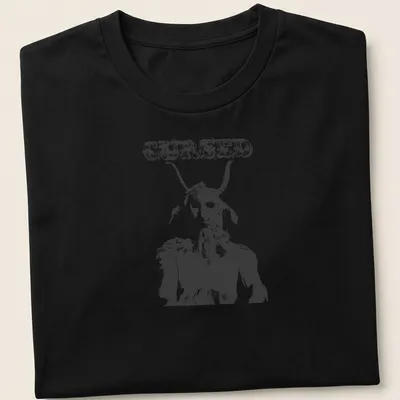 Distressed illustration of a goat creature with the text CURSED in bold letters — printed on a unisex t-shirt