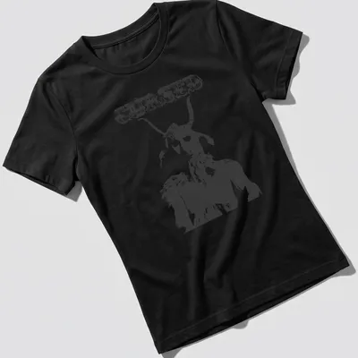 Distressed illustration of a goat creature with the text CURSED in bold letters — printed on a women's shirt