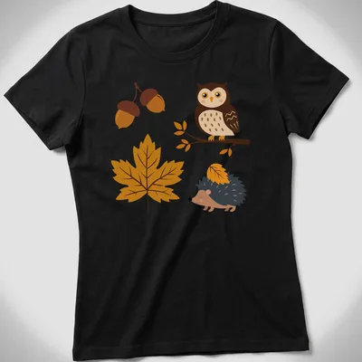 Kawaii design with an owl and hedgehog surrounded by acorns and leaves in autumn colors — printed on a women's shirt