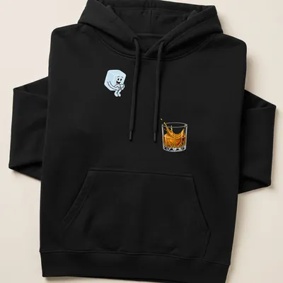 Cartoon ice cube splashing in a whiskey glass in light blue and orange — printed on a unisex hoodie