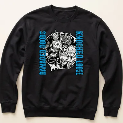 Bold graphic tee with the phrase 'Damaged Goods Knocked Loose' and chaotic illustrated characters in black, blue, and white. — printed on a unisex sweatshirt