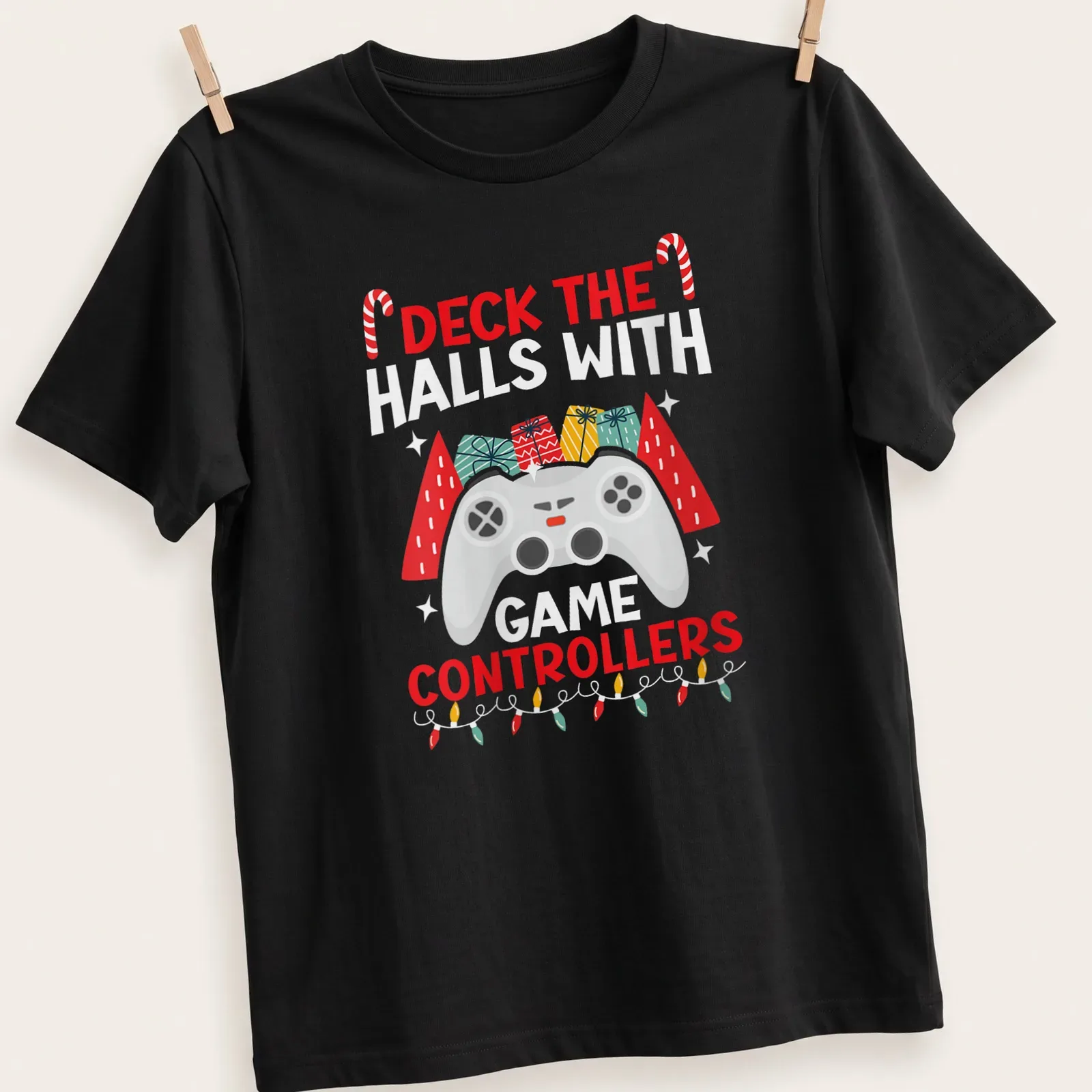 Colorful festive design with game controllers and holiday text — printed on a unisex t-shirt