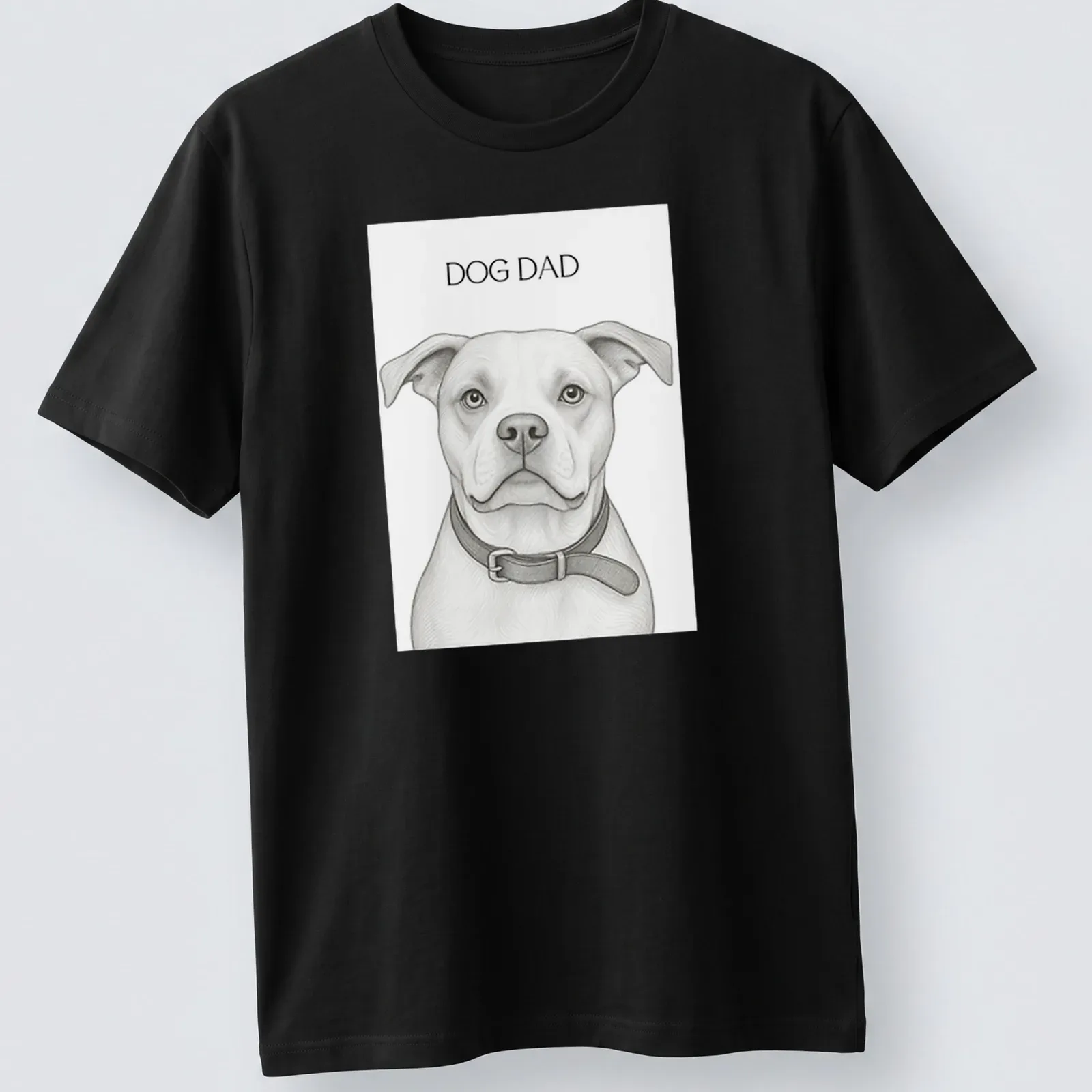 Sketch-style Dog Dad t-shirt featuring a playful dog illustration in monochrome — printed on a unisex t-shirt