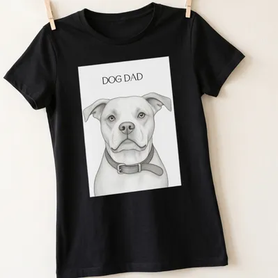 Sketch-style Dog Dad t-shirt featuring a playful dog illustration in monochrome — printed on a women's shirt