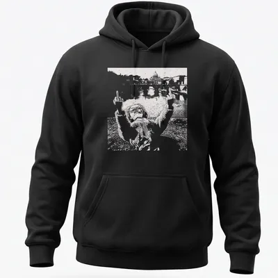 Distressed print of a playful doll face in black and white — printed on a unisex hoodie