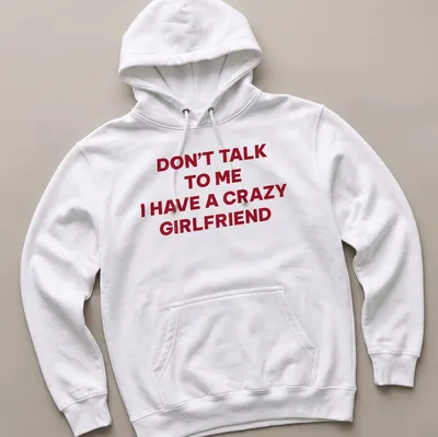 Bold typography tee stating Don't Talk To Me I Have A Crazy Girlfriend in red and white — printed on a unisex hoodie
