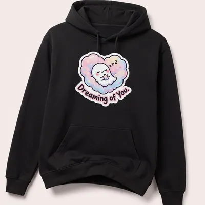 Kawaii ghost peeking from cloud with pastel colors and text Dreaming of You. — printed on a unisex hoodie