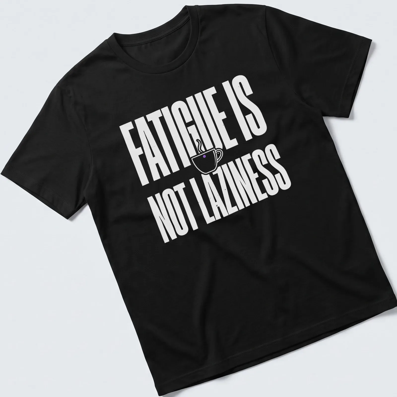 Bold typography tee featuring a coffee cup and the text 'Fatigue Is Not Laziness' in white on a purple background. — printed on a unisex t-shirt