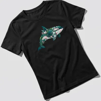Botanical illustration of an orca whale surrounded by floral elements in teal, pink, and green. — printed on a women's shirt