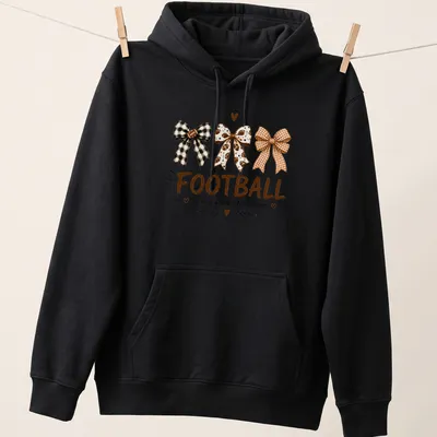 Whimsical illustration of football-themed bows with the text Football is my favorite season — printed on a unisex hoodie
