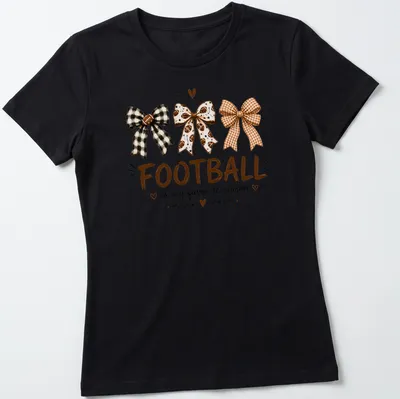 Whimsical illustration of football-themed bows with the text Football is my favorite season — printed on a women's shirt