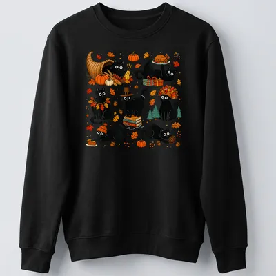 Cute kawaii black cats celebrating Thanksgiving with autumn elements — printed on a unisex sweatshirt