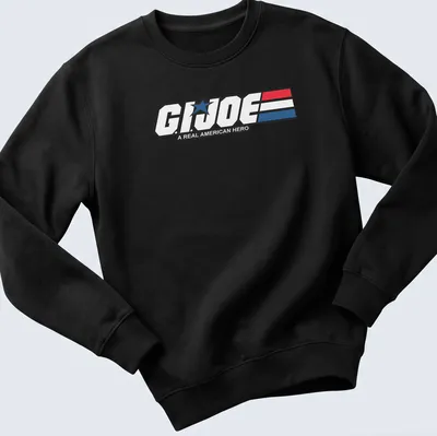 Bold graphic t-shirt featuring the G.I. Joe logo in red, white, and blue — printed on a unisex sweatshirt