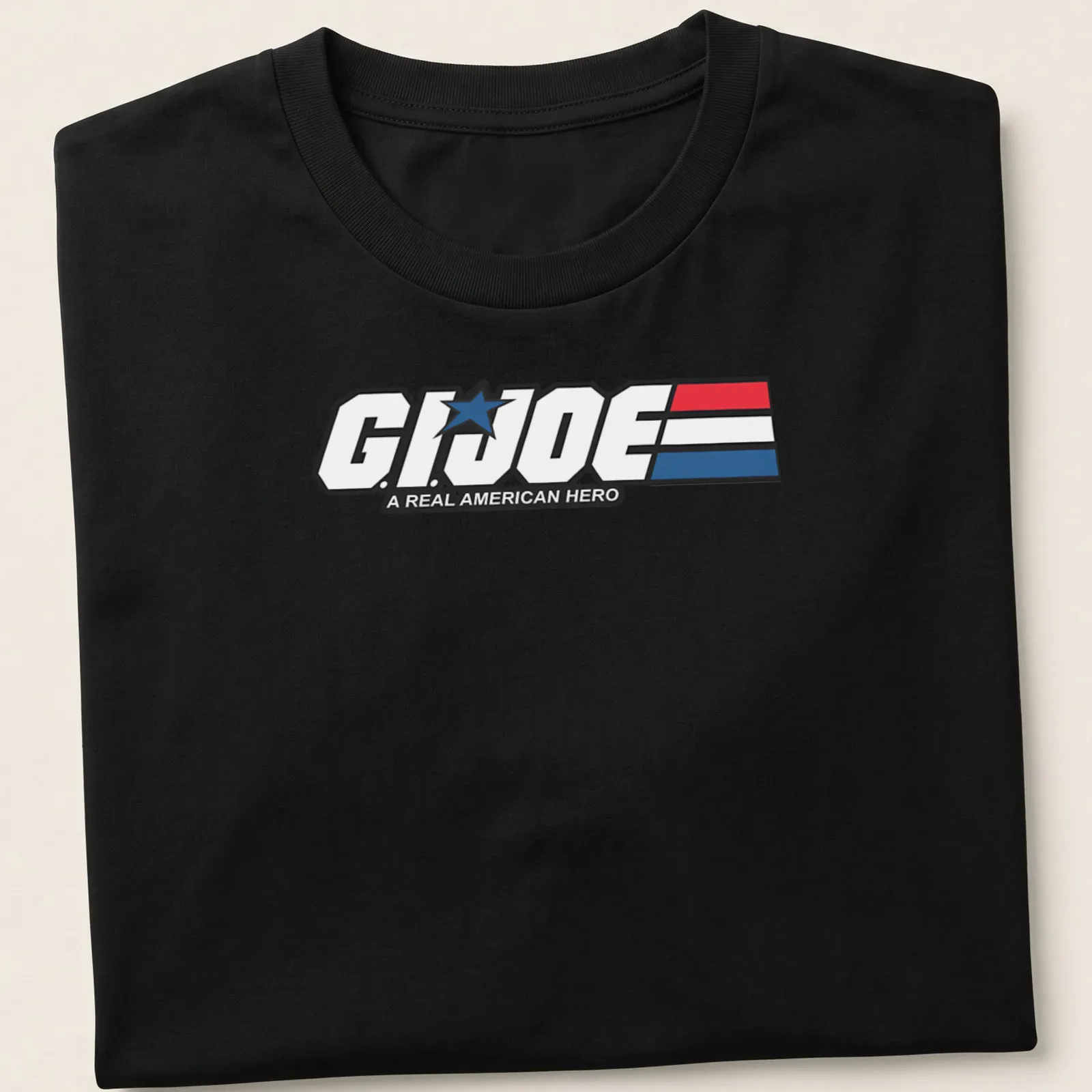 Bold graphic t-shirt featuring the G.I. Joe logo in red, white, and blue — printed on a unisex t-shirt