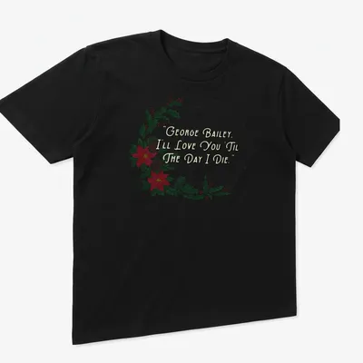 Watercolor Christmas t-shirt featuring a wreath and text about love. — printed on a unisex t-shirt (angled view)