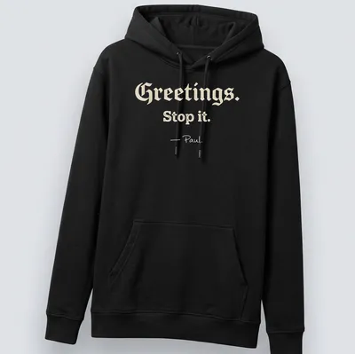 Playful script with Christian humor saying 'Greetings. Stop it. - Paul.' on a cream background — printed on a unisex hoodie