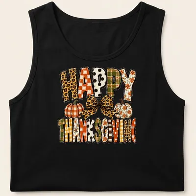 Leopard bow over pumpkins with "Happy Thanksgiving" text in festive colors — printed on a tank top
