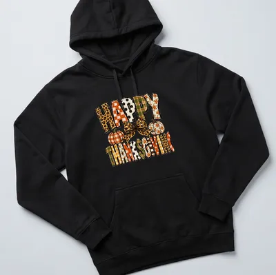 Leopard bow over pumpkins with "Happy Thanksgiving" text in festive colors — printed on a unisex hoodie