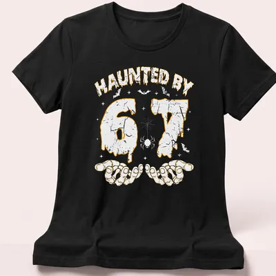 Halloween T-shirt with dripping text and skeleton hands design in orange — printed on a women's shirt
