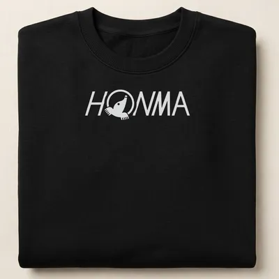 Black and white HOMMA logo in a clean vector style on a t-shirt. — printed on a unisex sweatshirt