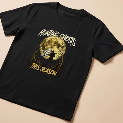 Vintage Halloween t-shirt featuring a ghost and hunter with text about hunting ghosts.