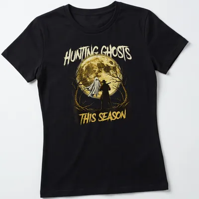 Vintage Halloween t-shirt featuring a ghost and hunter with text about hunting ghosts. — printed on a women's shirt