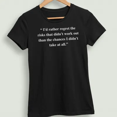 Inspirational text about taking risks printed on a — printed on a women's shirt